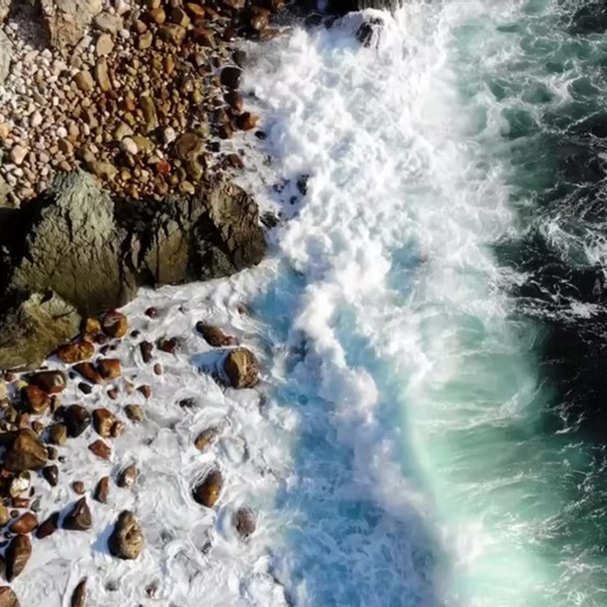 Rocky shoreline with waves